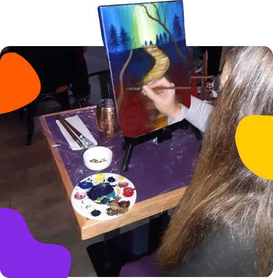 A woman painting a picture.