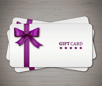 Two gift cards with purple bows on a wooden background.