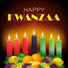 A happy kwanzaa background with candles and fruit.