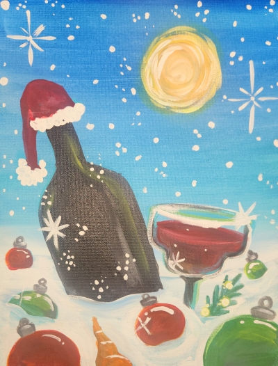 Wine bottle with small santa hat in snow with christmas ornaments.