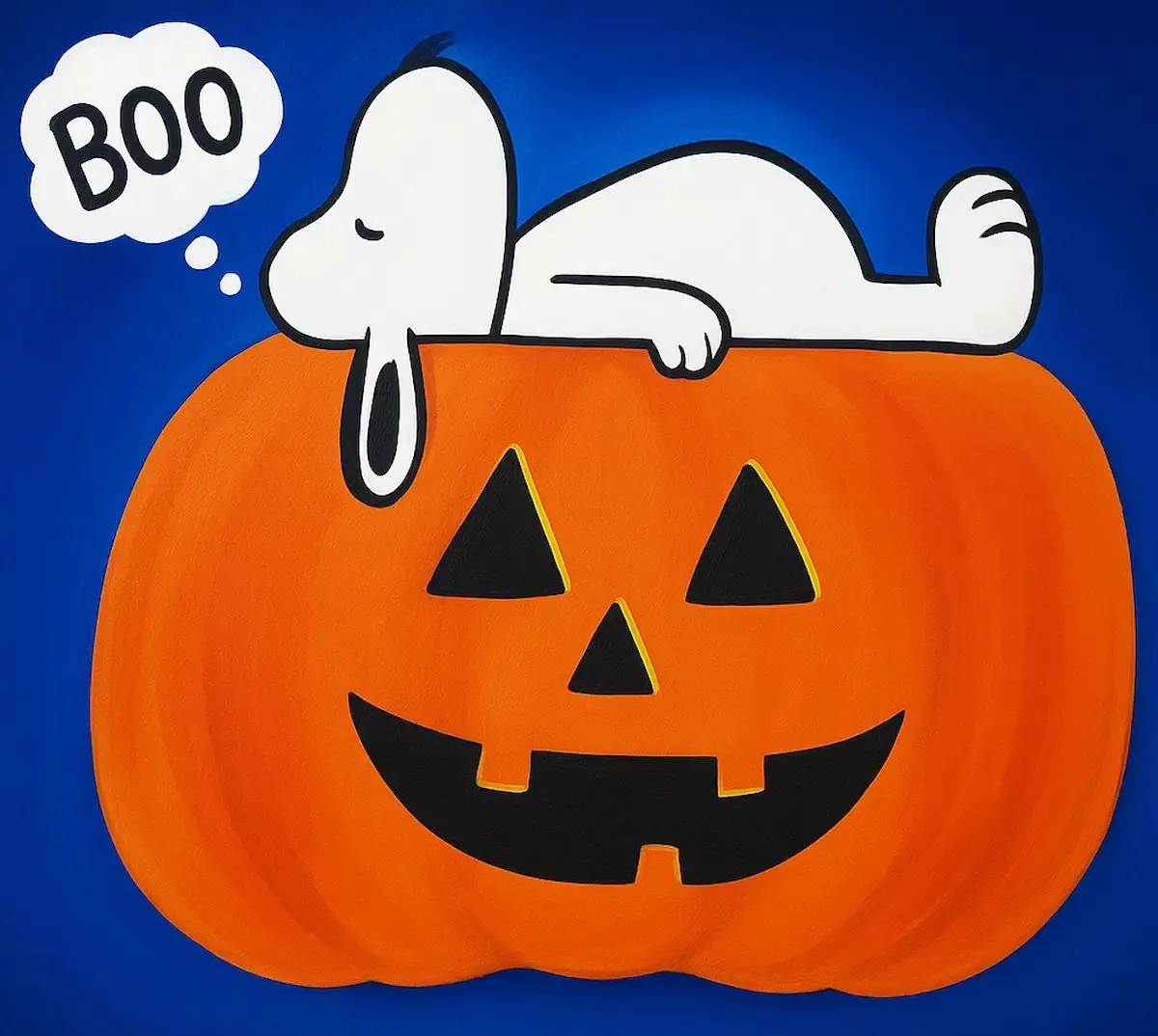 Snoopy lying on a large jack-o'-lantern saying "Boo".