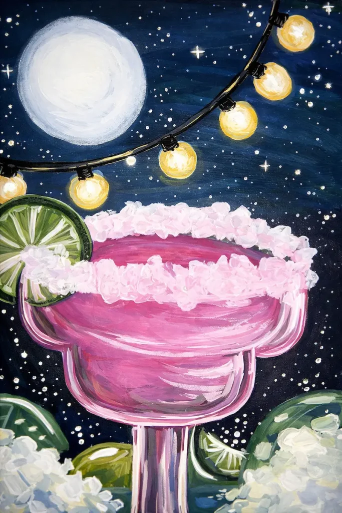 Pink margarita under moon and string lights.